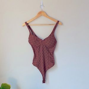 Vernacular bodysuit
